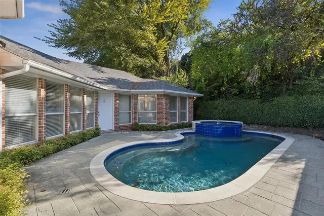 a view of a house with backyard sitting area and garden