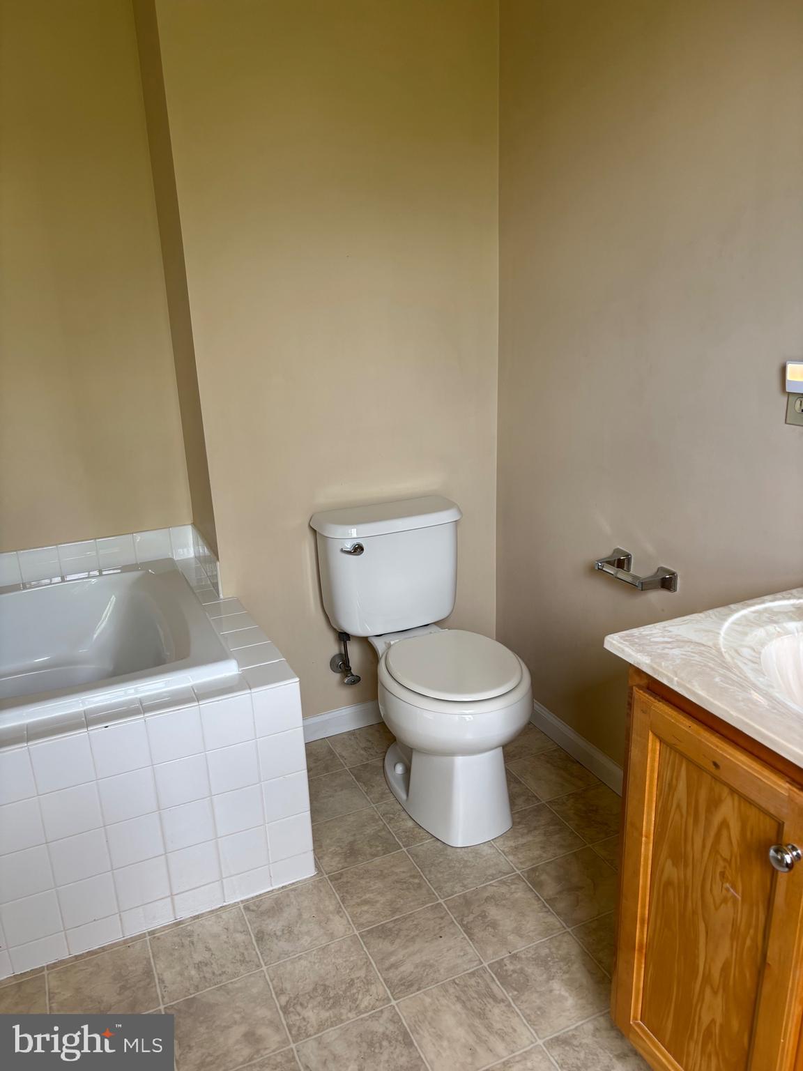 6846 Hunt Drive Macungie, PA 18062 - Photo 17 of 28 a white toilet sitting next to a bathroom sink