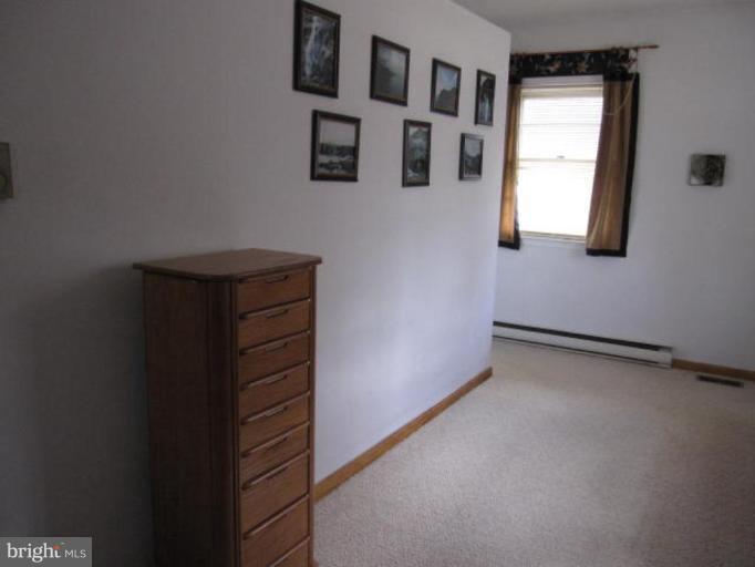 13240 Olivet Road Lusby, MD 20657 - Photo 13 of 24 a view of an empty room with window and stairs