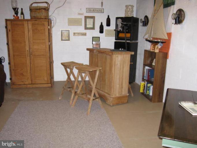 13240 Olivet Road Lusby, MD 20657 - Photo 17 of 24 a view of a dining room with furniture and wooden floor