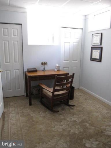 13240 Olivet Road Lusby, MD 20657 - Photo 18 of 24 a room with furniture and window