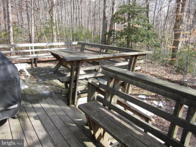 13240 Olivet Road Lusby, MD 20657 - Photo 21 of 24 a view of a chairs and tables in the balcony