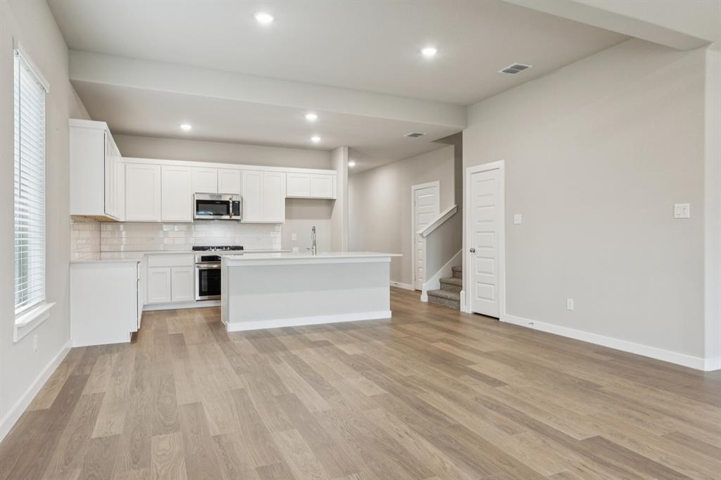 15212 Supreme Street Aledo, TX 76008 - Photo 12 of 34 First Floor in the Stanley II home plan by Trophy Signature Homes – REPRESENTATIVE PHOTO