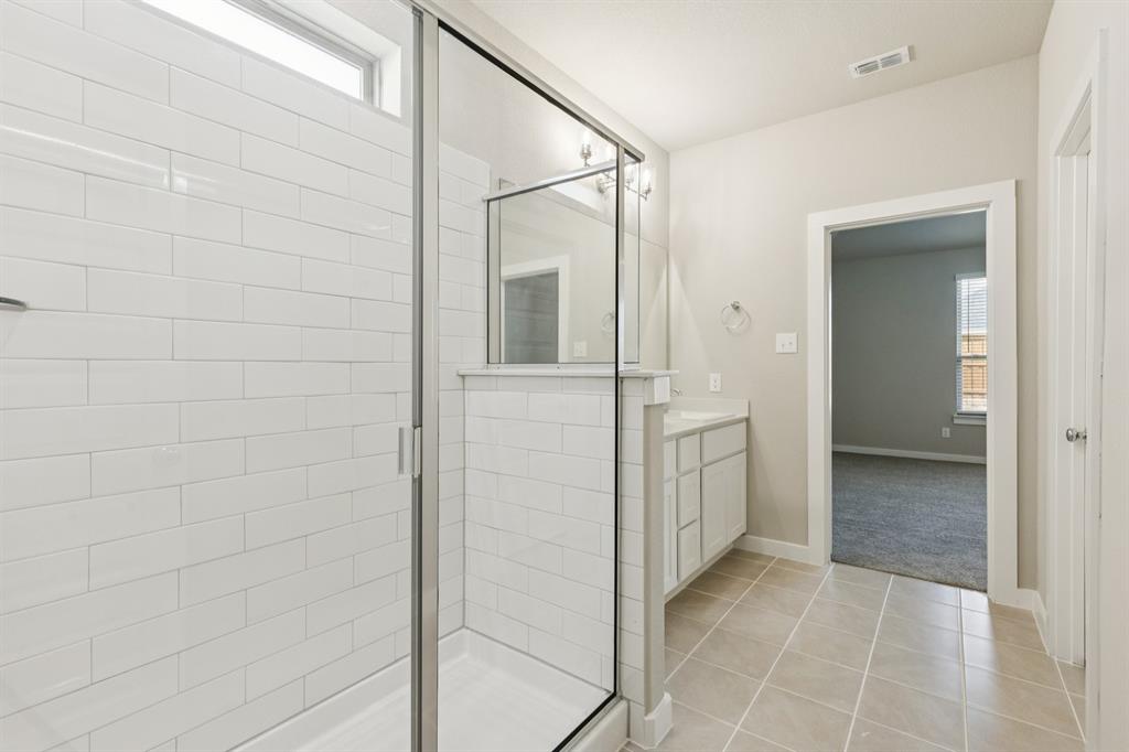 15212 Supreme Street Aledo, TX 76008 - Photo 21 of 34 Primary Bathroom in the Stanley II home plan by Trophy Signature Homes – REPRESENTATIVE PHOTO