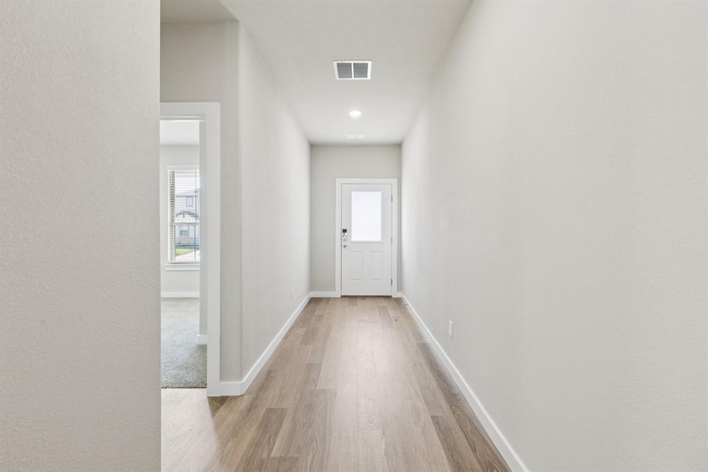 15212 Supreme Street Aledo, TX 76008 - Photo 31 of 34 Entryway in the Stanley II home plan by Trophy Signature Homes – REPRESENTATIVE PHOTO