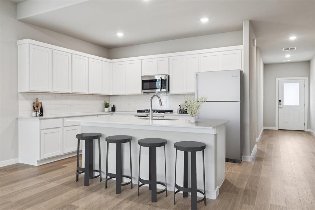 15212 Supreme Street Aledo, TX 76008 - Photo 7 of 34 Kitchen in the Stanley II home plan by Trophy Signature Homes – REPRESENTATIVE PHOTO