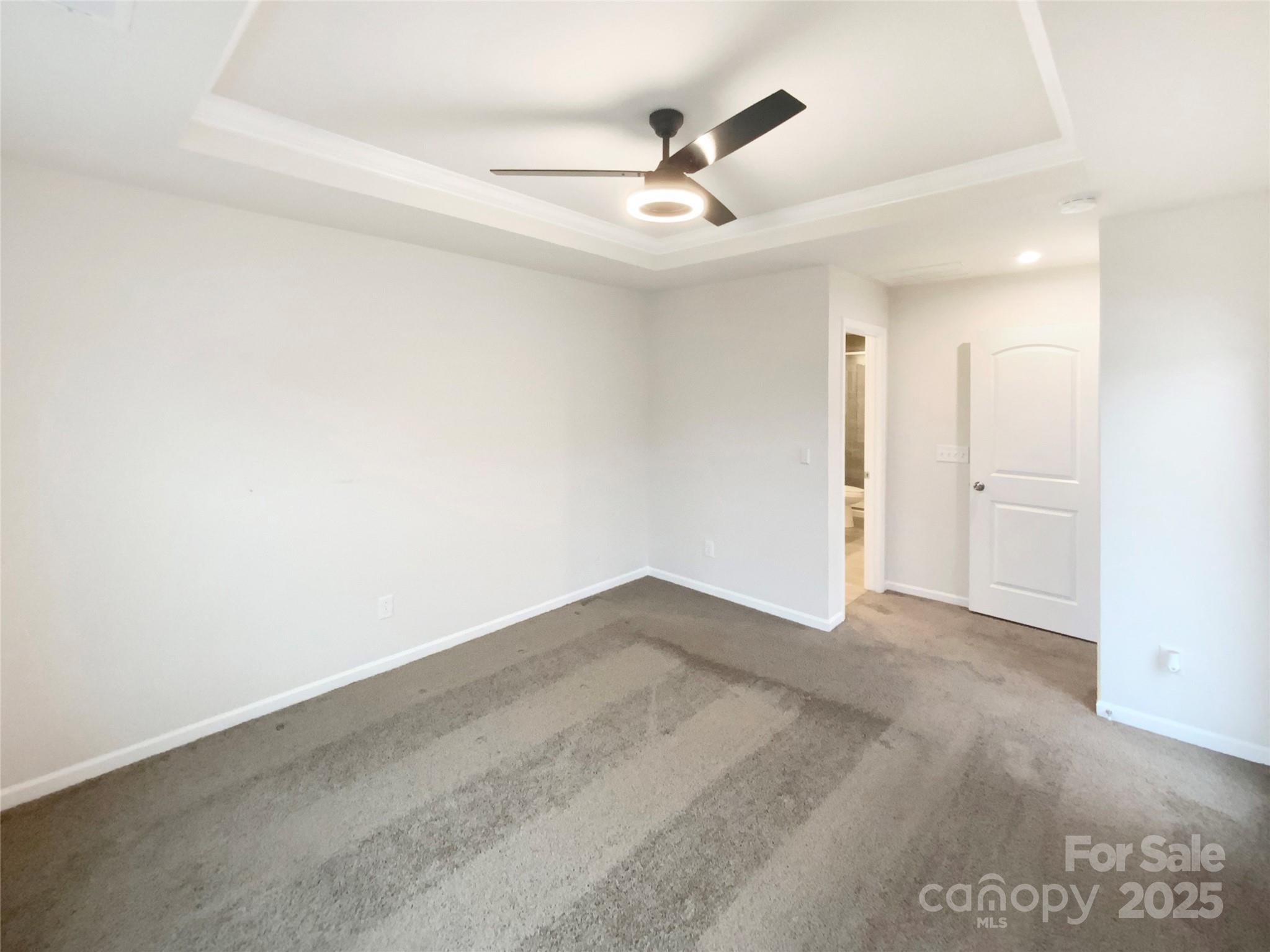 4105 Galloway Road Charlotte, NC 28262 - Photo 18 of 23 an empty room with a chandelier fan and windows
