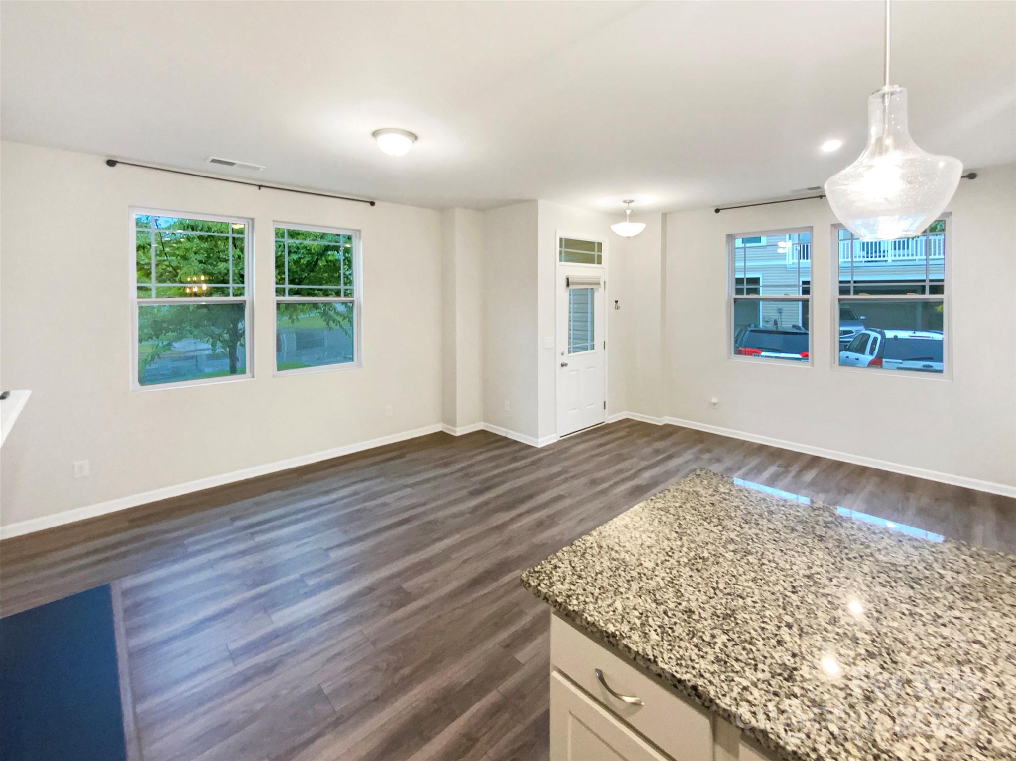 4105 Galloway Road Charlotte, NC 28262 - Photo 10 of 23 an empty room with wooden floor and windows