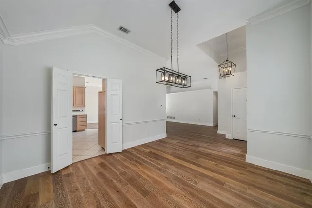 a view of an entryway with wooden floor
