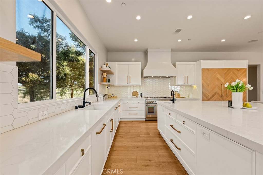 13248 Nightsky Drive Camarillo, CA 93012 - Photo 14 of 53 a large kitchen with stainless steel appliances kitchen island a large window