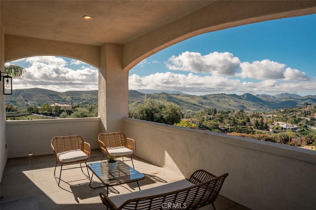 13248 Nightsky Drive Camarillo, CA 93012 - Photo 21 of 53 a view of a chairs and table in a balcony