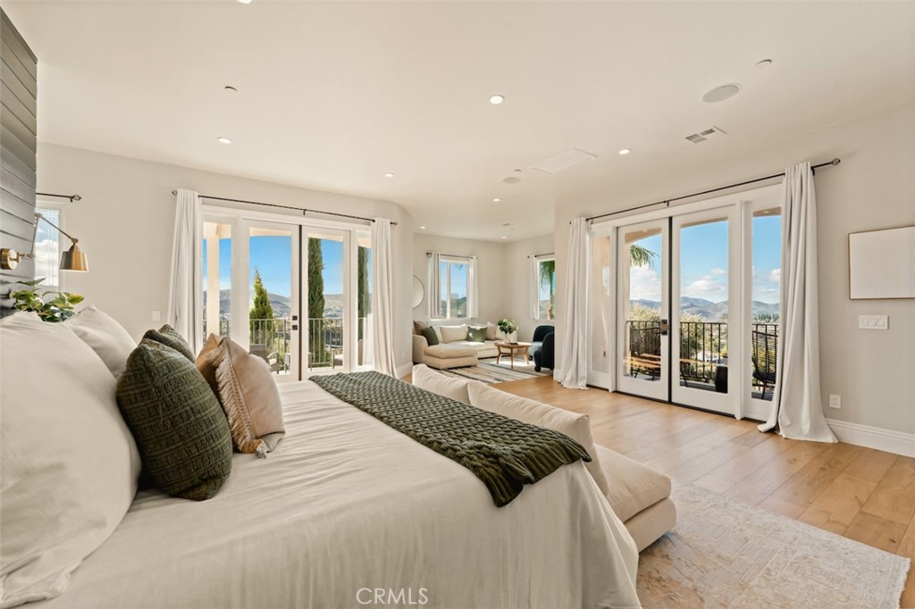 13248 Nightsky Drive Camarillo, CA 93012 - Photo 25 of 53 a large bedroom with a large bed and large windows