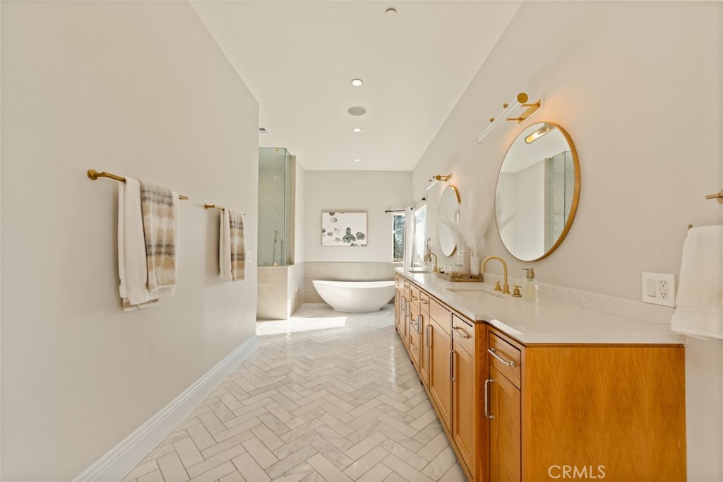 13248 Nightsky Drive Camarillo, CA 93012 - Photo 26 of 53 a large bathroom with a granite countertop toilet a sink and a mirror