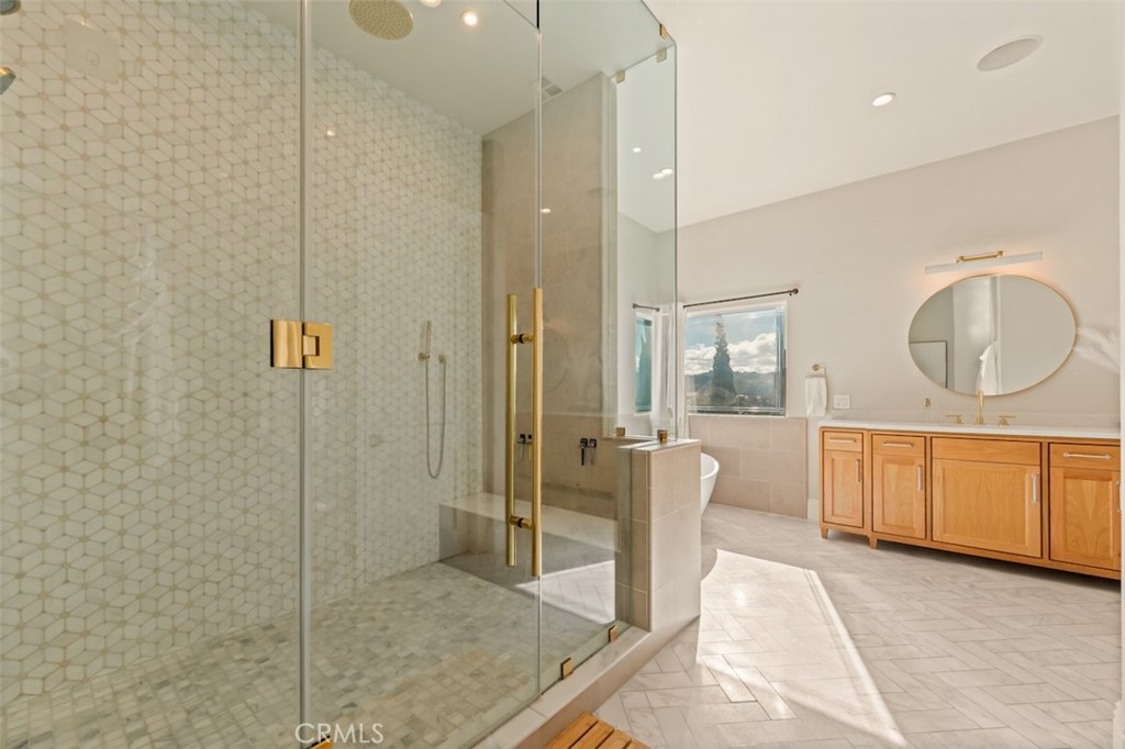 13248 Nightsky Drive Camarillo, CA 93012 - Photo 28 of 53 a spacious bathroom with a mirror a bathtub and shower