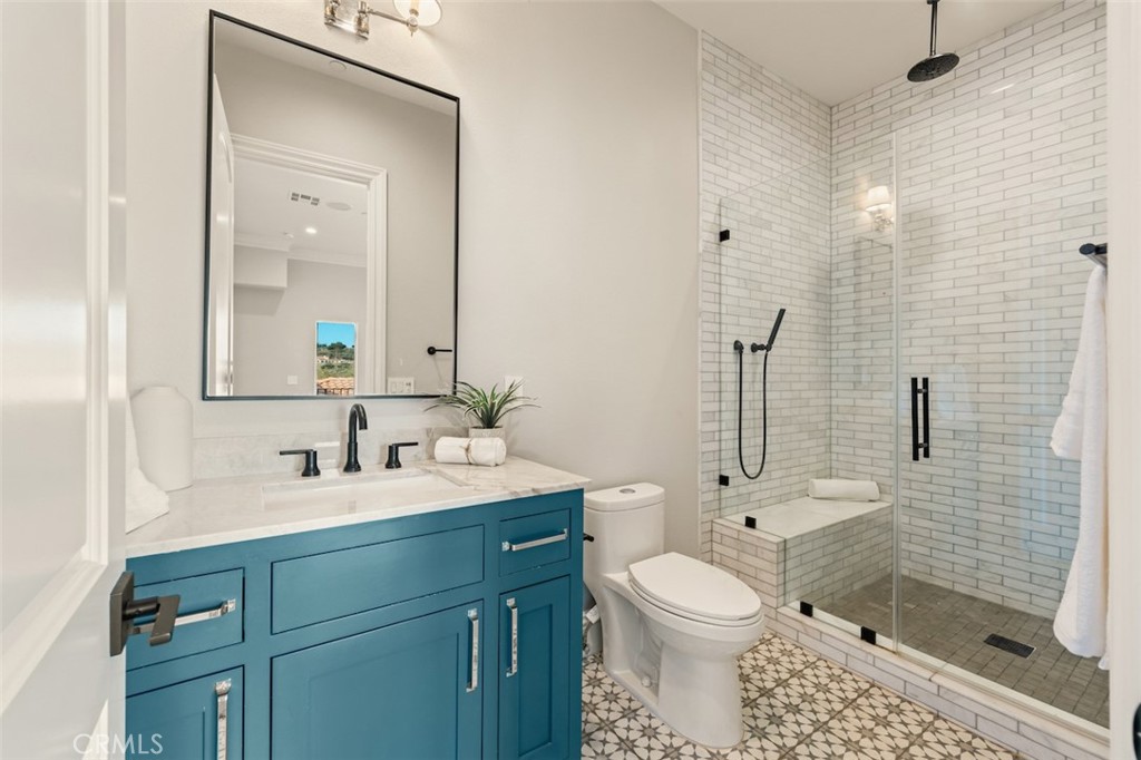 13248 Nightsky Drive Camarillo, CA 93012 - Photo 32 of 53 a bathroom with a toilet sink shower and mirror