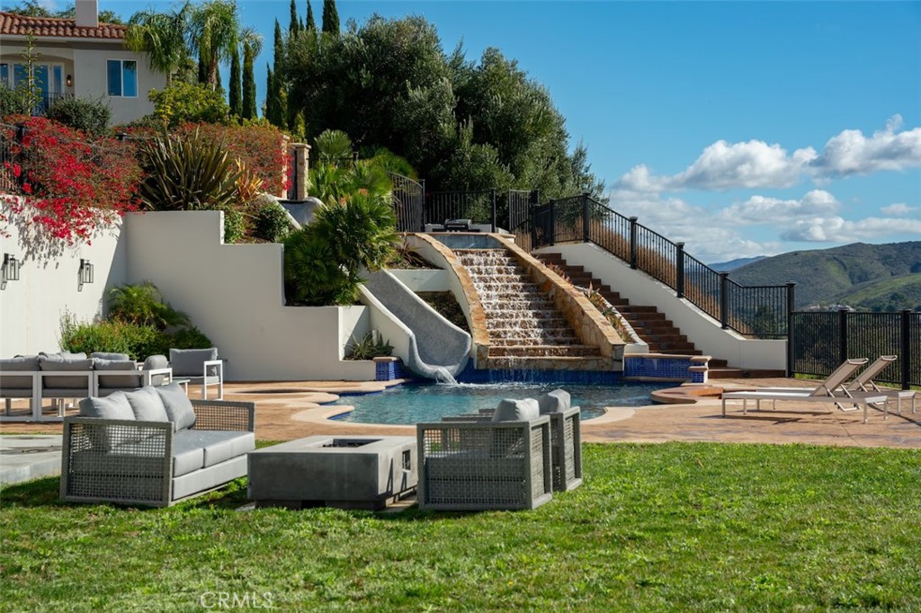 13248 Nightsky Drive Camarillo, CA 93012 - Photo 43 of 53 a view of a patio with table and chairs potted plants and large tree