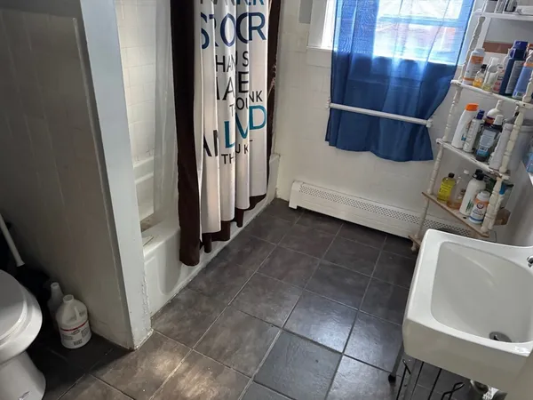 a bathroom with a sink and toilet