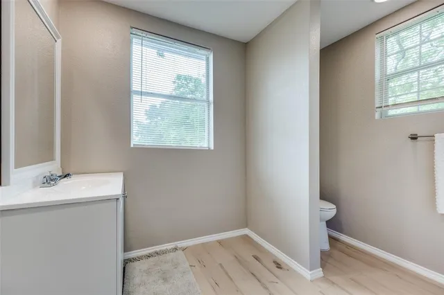 a bathroom with a sink and a window