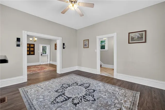 a view of a big room with wooden floor and closet