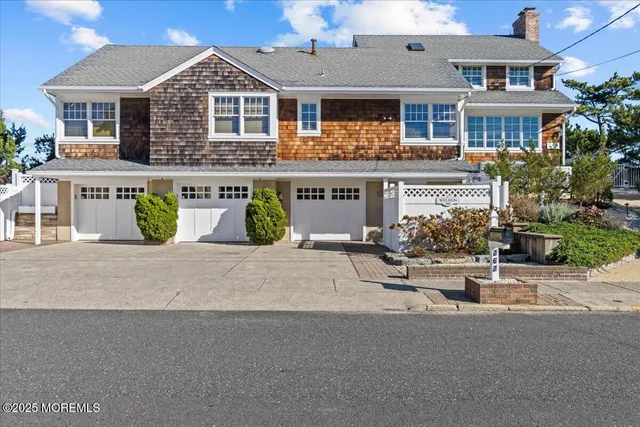 a view of a patio with table and chairs under an umbrella