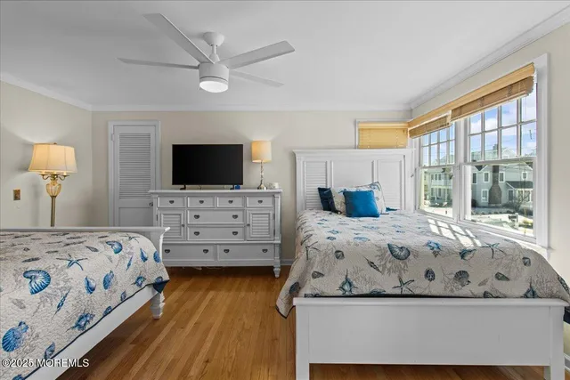 a bedroom with a bed next to a window with outer view