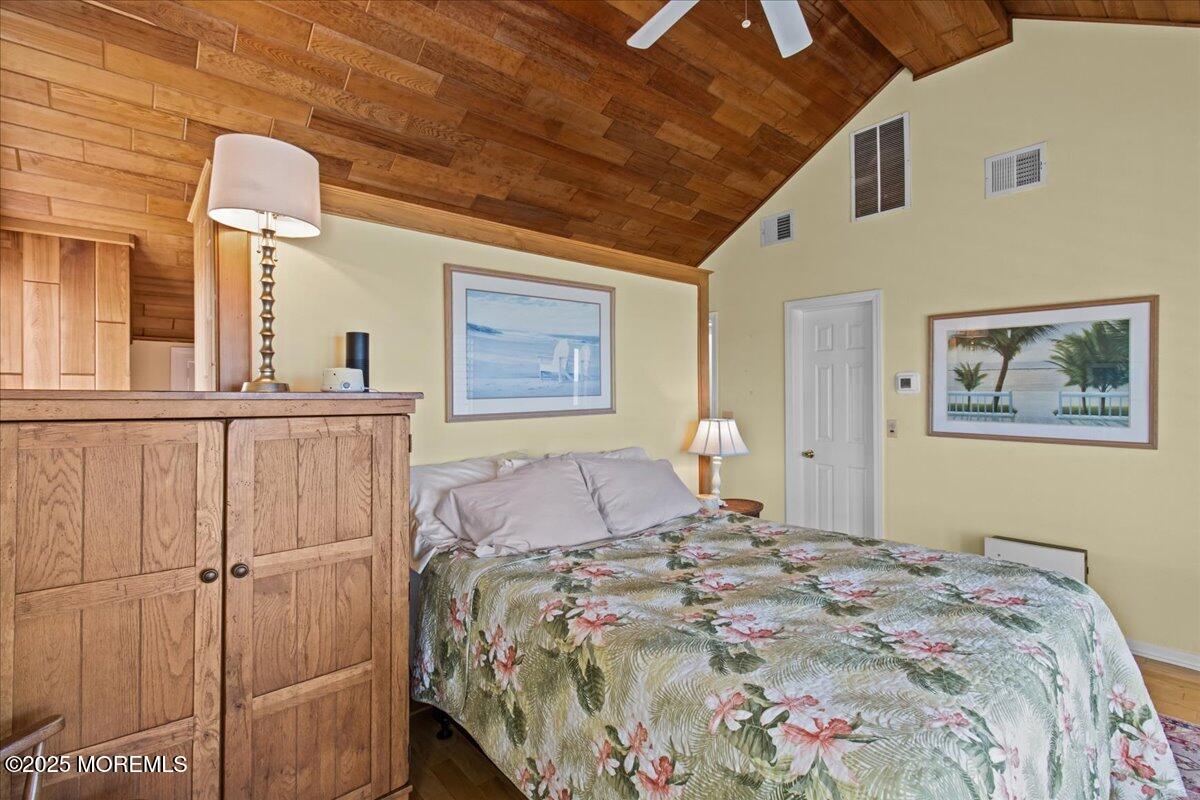 262 Sunset Lane Mantoloking, NJ 08738 - Photo 26 of 45 a bedroom with a large bed and a window