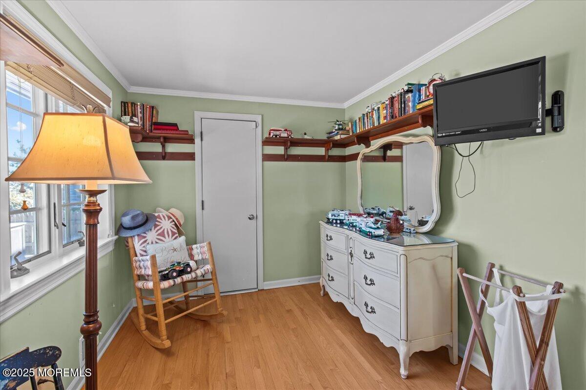 262 Sunset Lane Mantoloking, NJ 08738 - Photo 28 of 45 a room with furniture and a flat screen tv