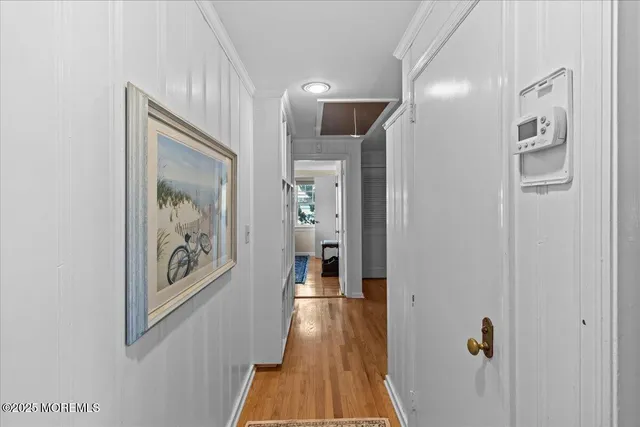 a bedroom with a bed and windows