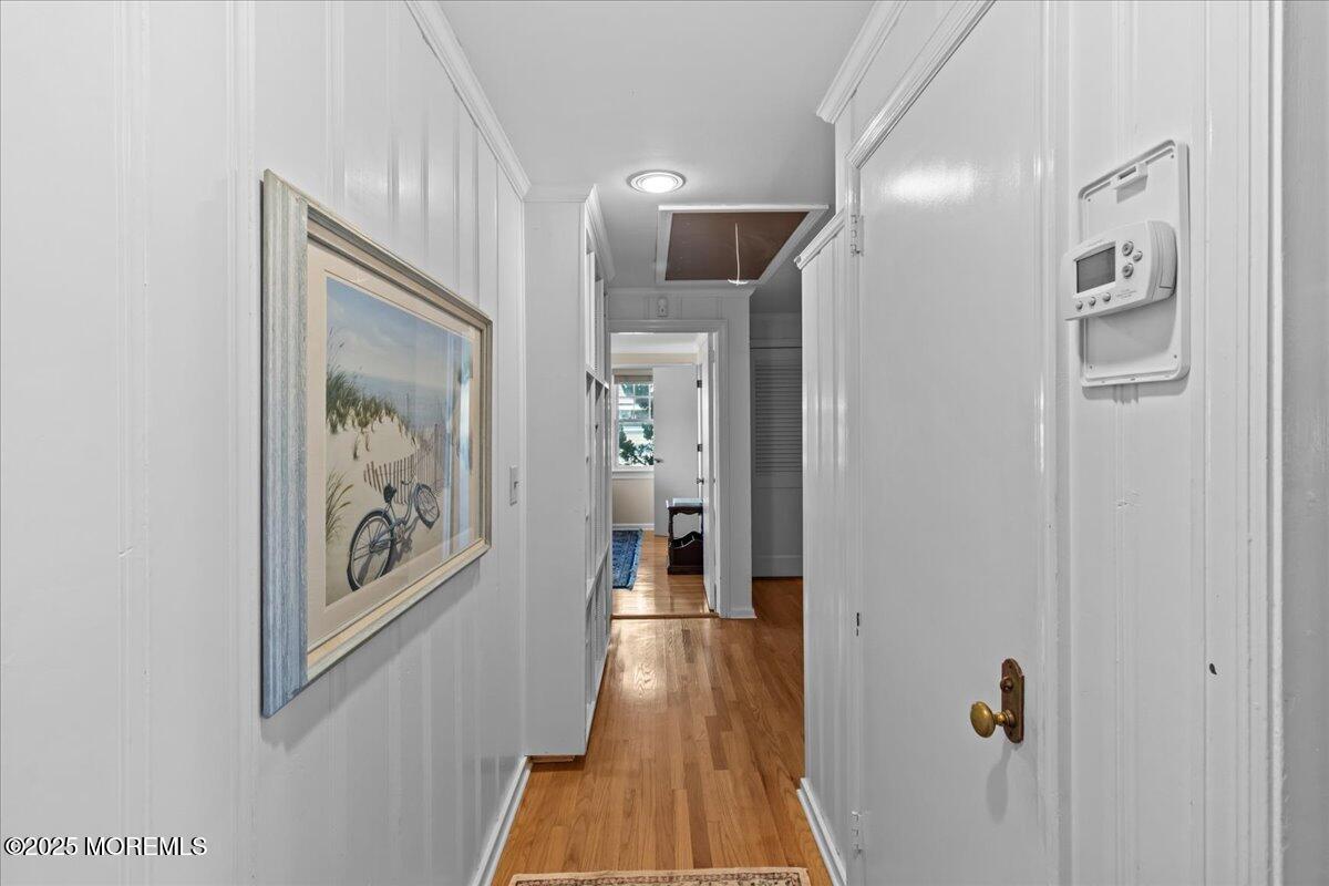 262 Sunset Lane Mantoloking, NJ 08738 - Photo 30 of 45 a view of a hallway view with wooden floor and staircase