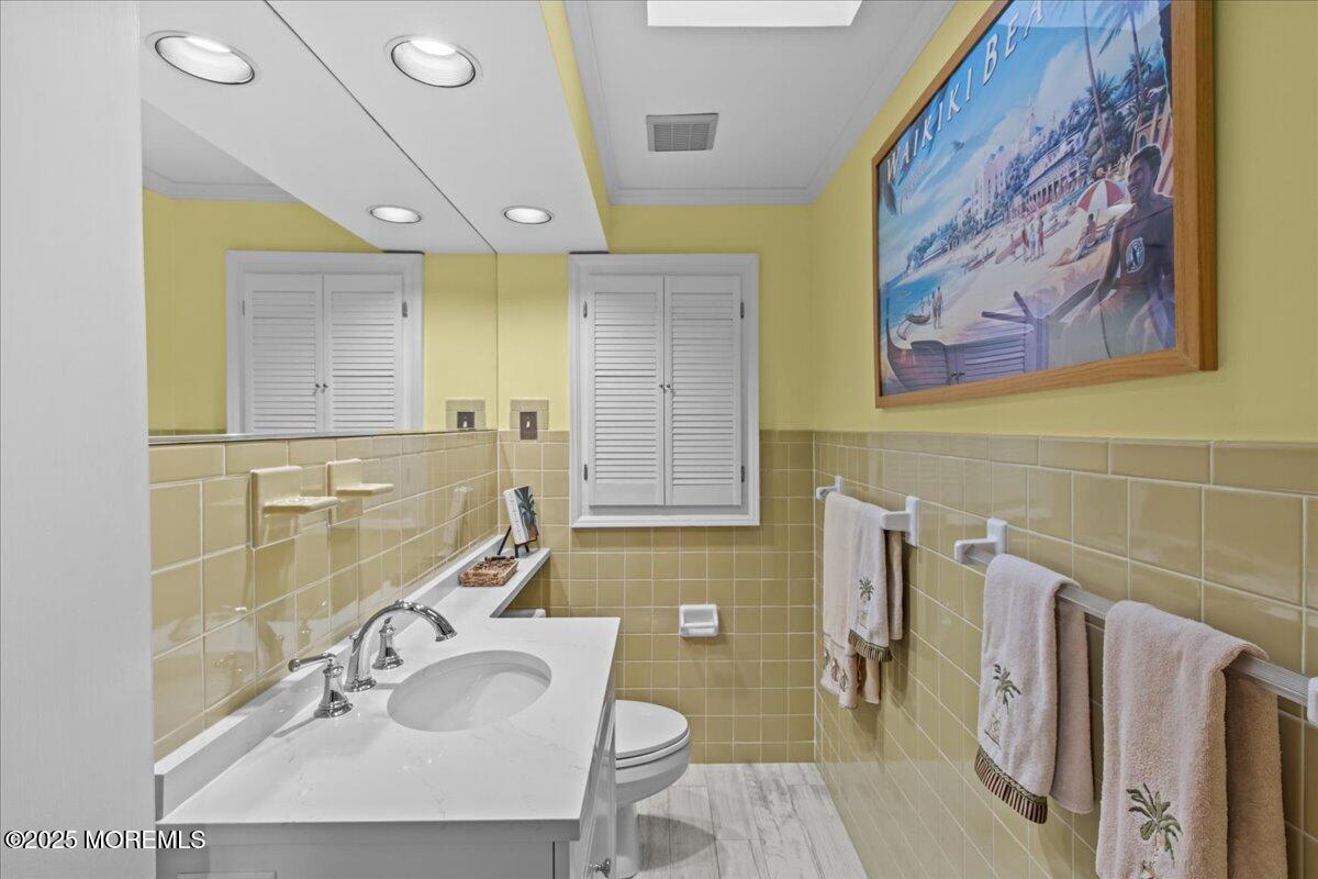 262 Sunset Lane Mantoloking, NJ 08738 - Photo 38 of 45 a bathroom with a sink and a mirror