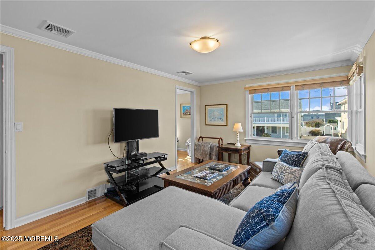 262 Sunset Lane Mantoloking, NJ 08738 - Photo 8 of 45 a living room with furniture and a flat screen tv