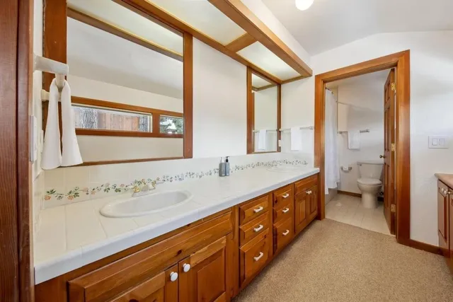 a bedroom with a large bed and a balcony view