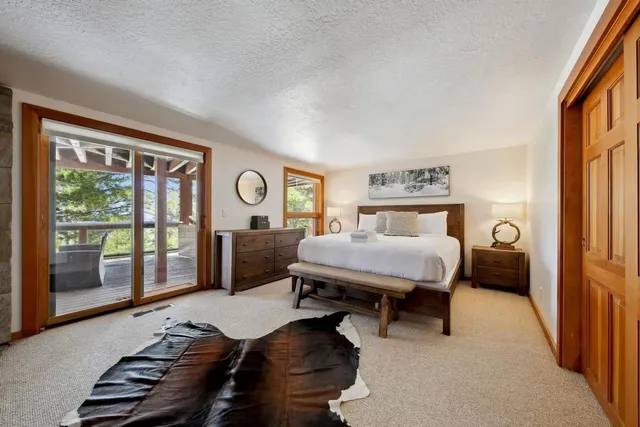 a bedroom with a bed and a table in it