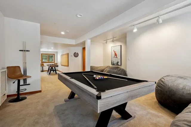 a view of living room with furniture and wooden floor