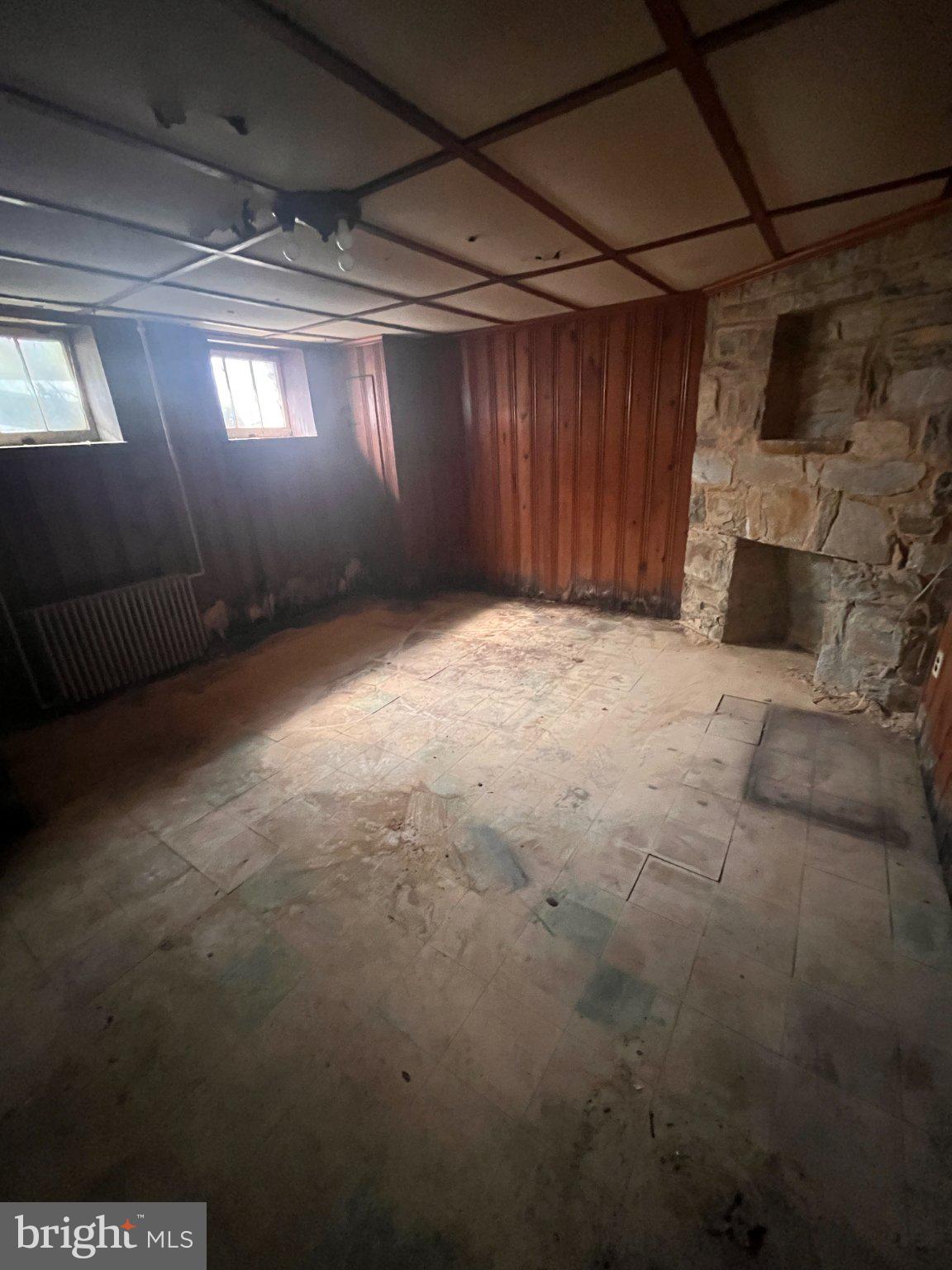 5906 Ayleshire Road Baltimore, MD 21239 - Photo 13 of 41 Basement room with stone accent and half bath.