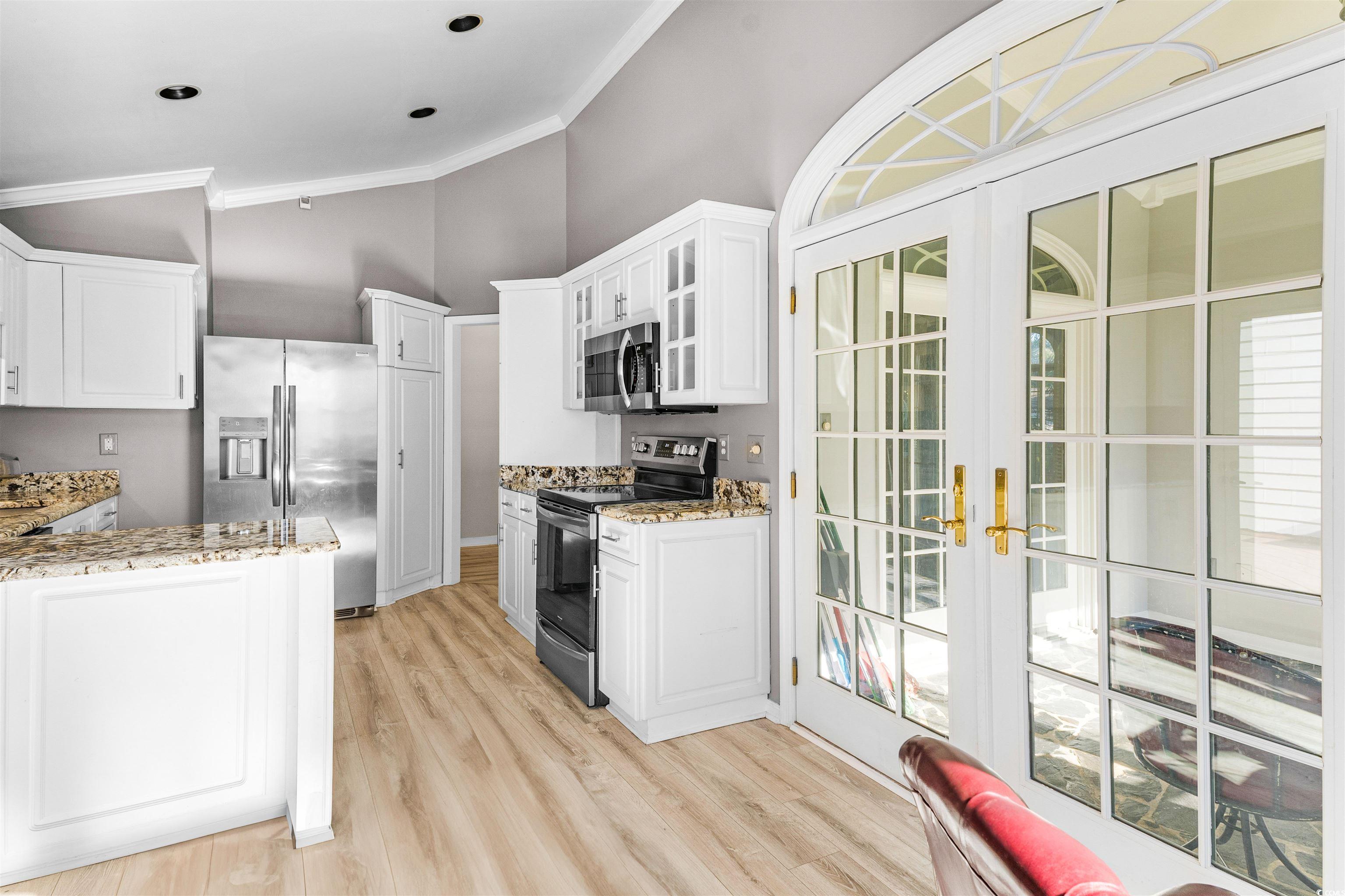 366 Pilothouse Drive Myrtle Beach, SC 29577 - Photo 13 of 40 Kitchen with white cabinets, crown molding, light
