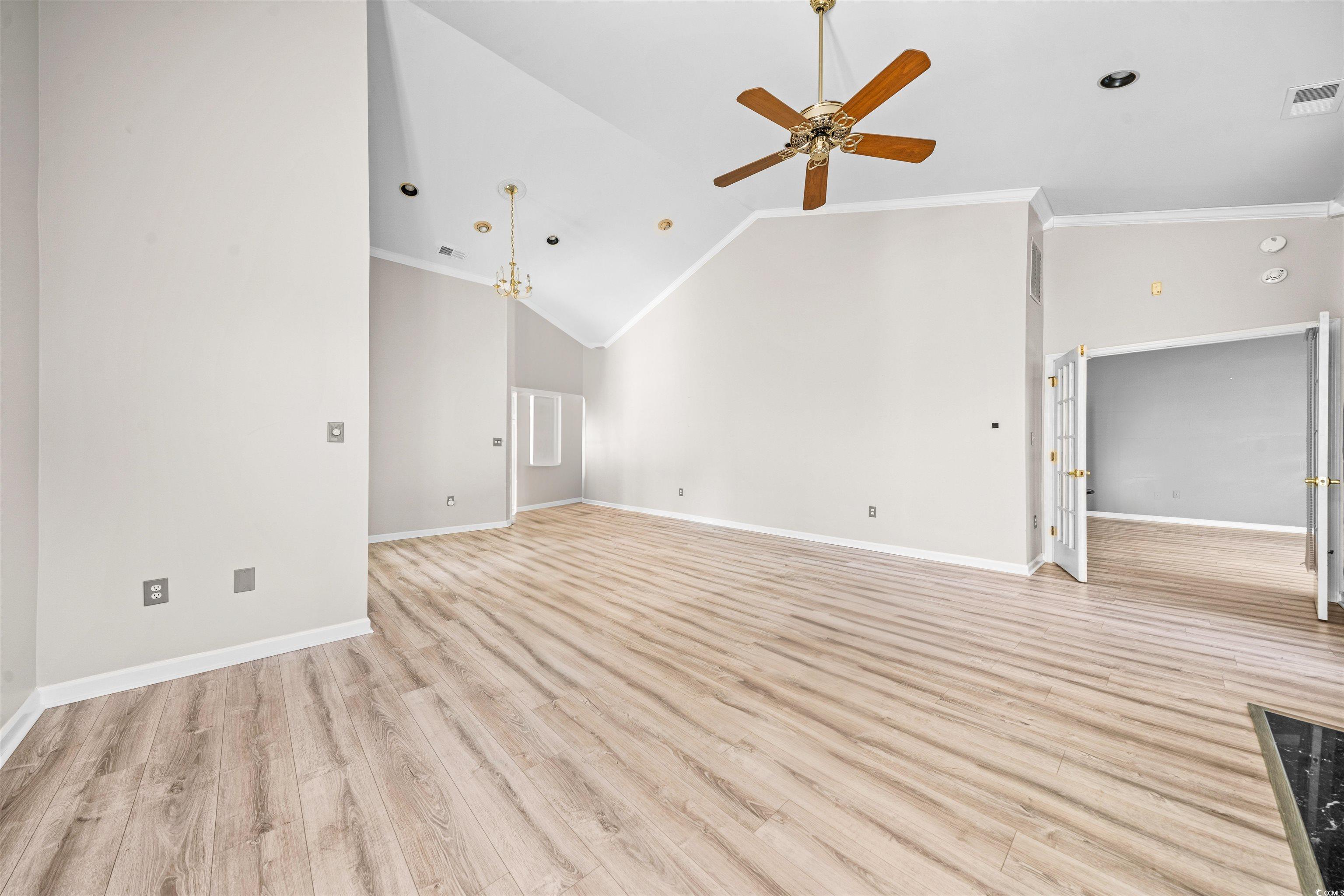 366 Pilothouse Drive Myrtle Beach, SC 29577 - Photo 8 of 40 Unfurnished living room featuring crown molding, h