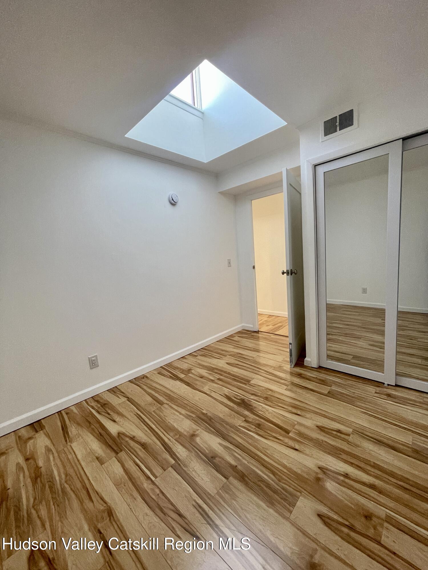 720 Warren Street, Unit 7 Hudson, NY 12534 - Photo 5 of 10 wooden floor in an empty room