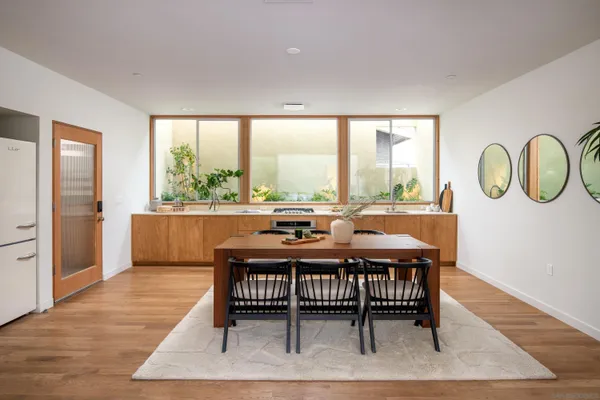 a view of a dining room with furniture window and wooden floor