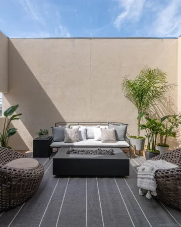 a sitting area with furniture and a rug