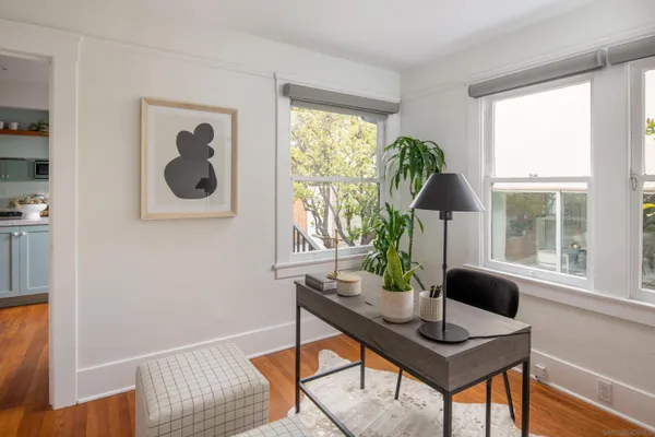 a workspace with furniture and a window