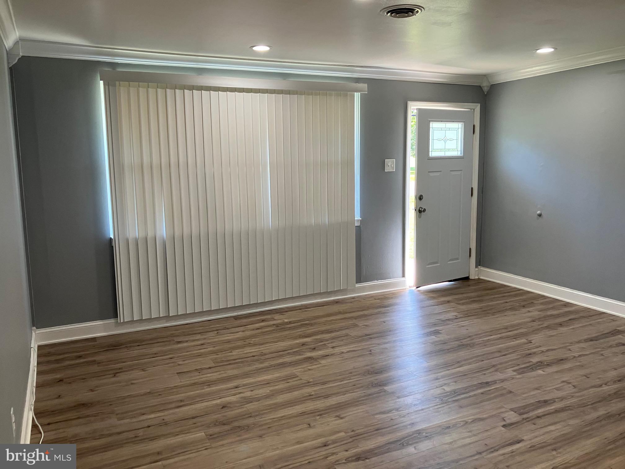 928 Pemberton - Browns Mills Road Pemberton, NJ 08068 - Photo 3 of 10 a view of wooden floor and windows in a room
