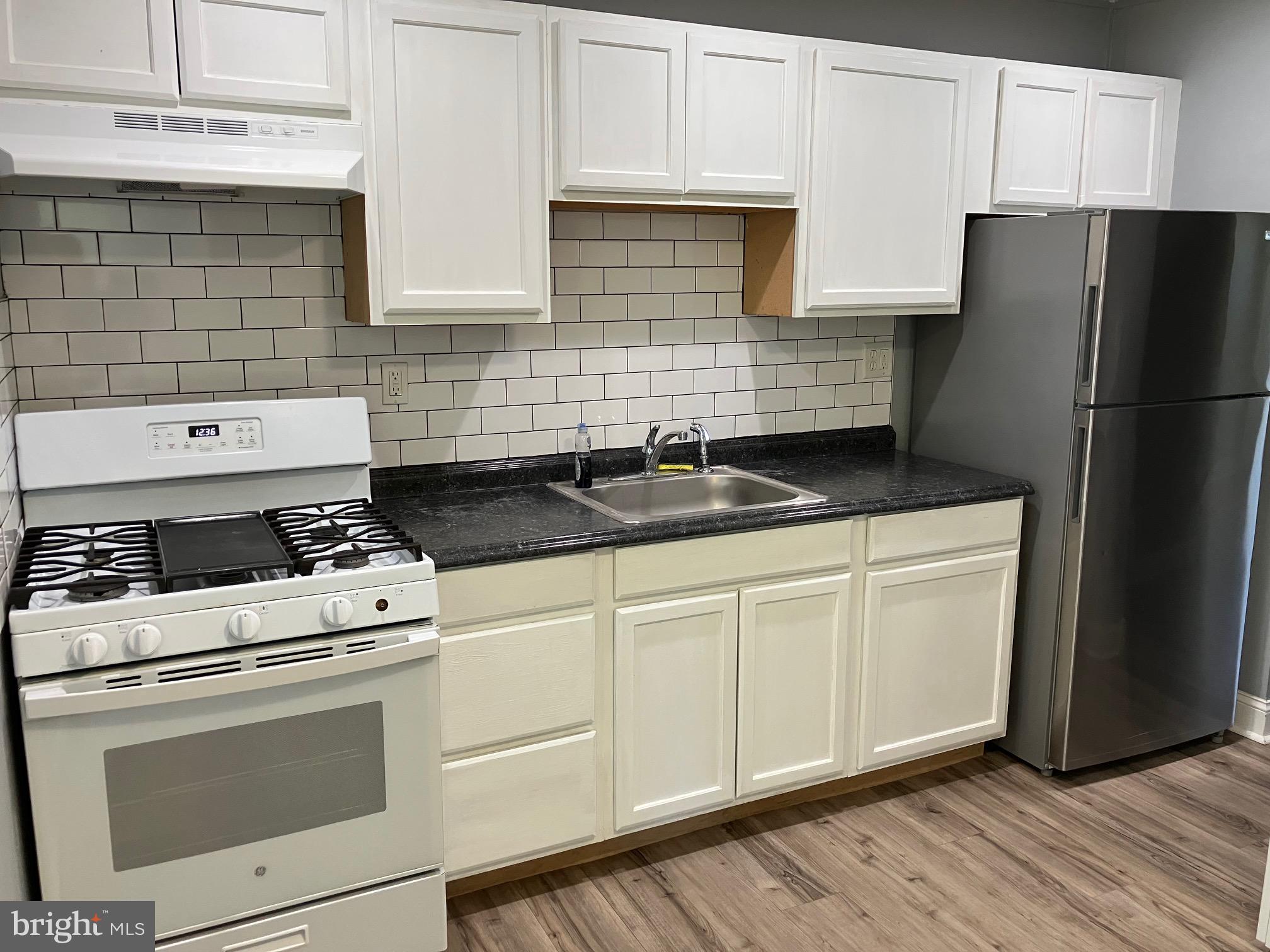 928 Pemberton - Browns Mills Road Pemberton, NJ 08068 - Photo 4 of 10 a kitchen with granite countertop white cabinets and white appliances
