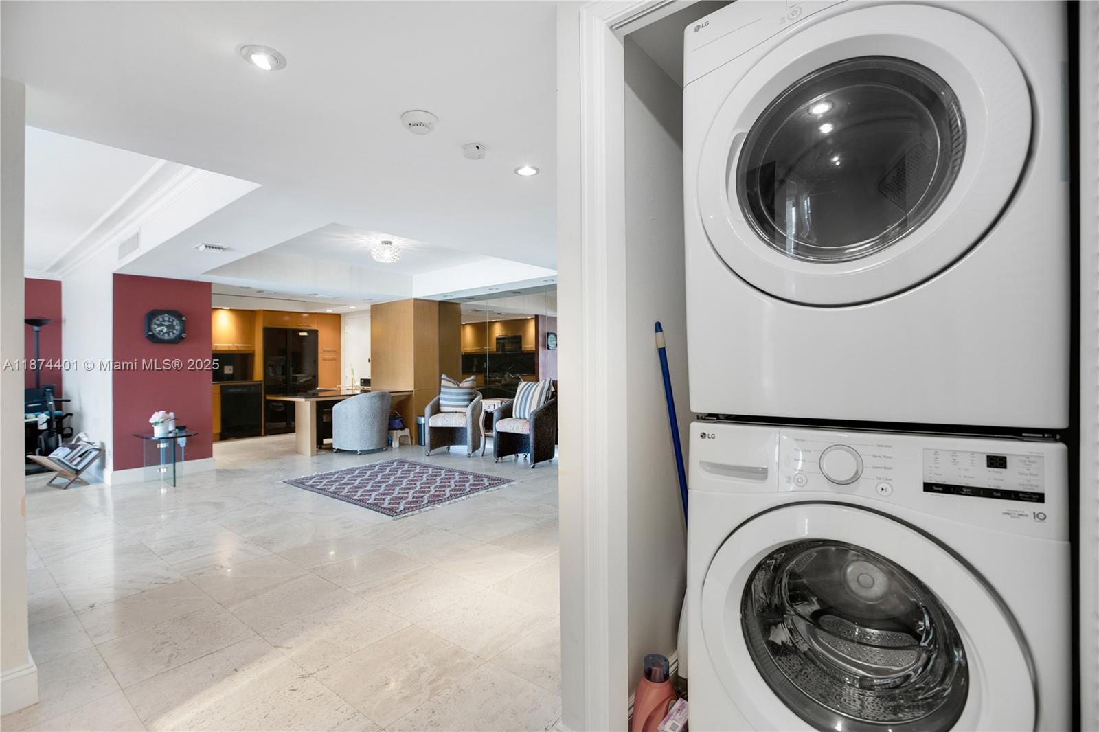 3 Grove Isle Drive, Unit C1108 Miami, FL 33133 - Photo 15 of 29 a view of a hallway with washer and dryer
