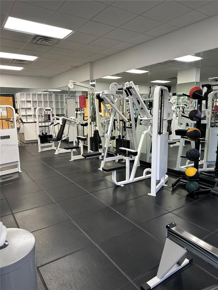 3 Grove Isle Drive, Unit C1108 Miami, FL 33133 - Photo 22 of 29 a view of a room with gym equipment