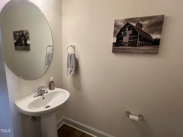 a bathroom with a sink and mirror