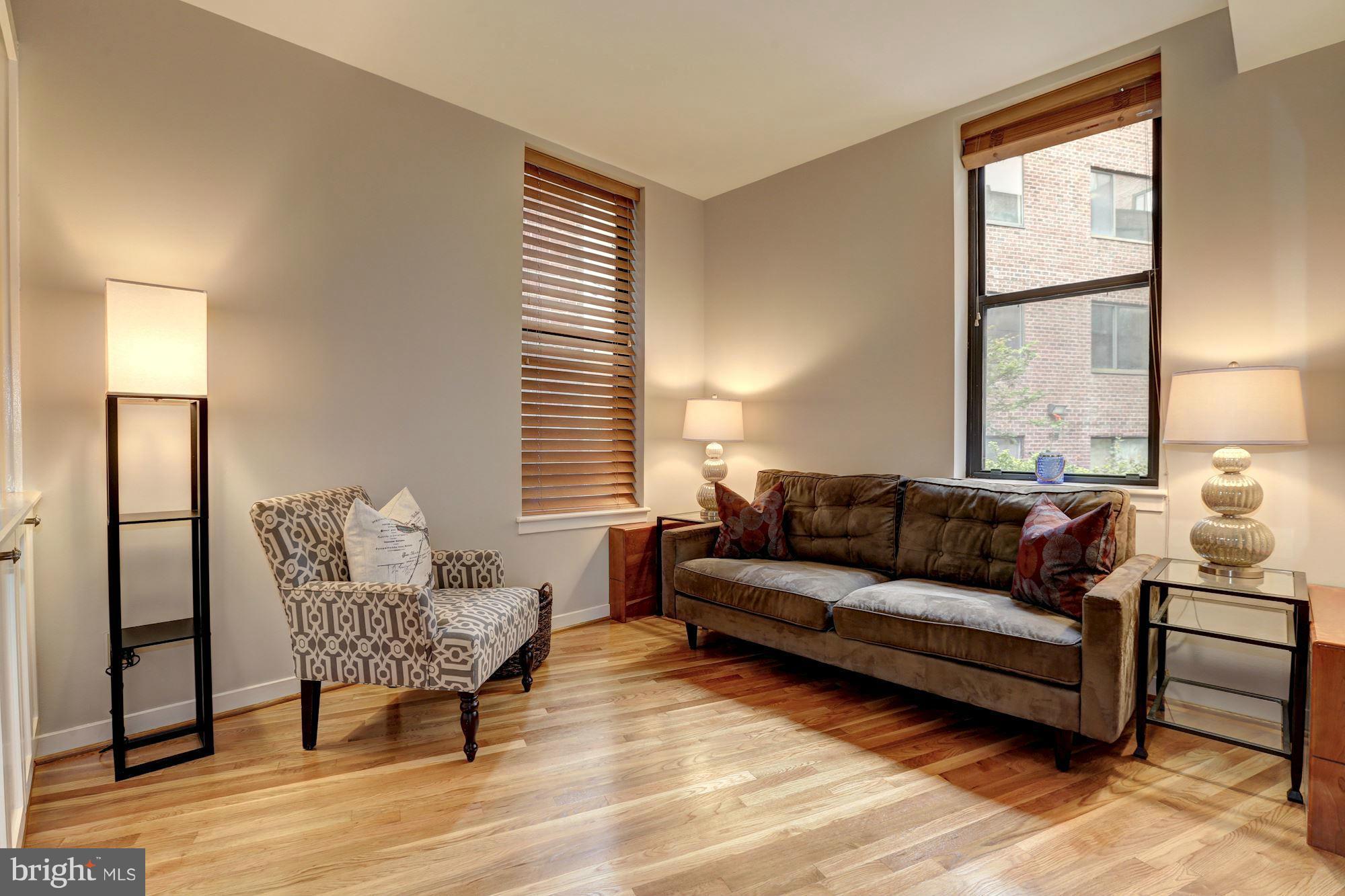 3 Washington Circle Northwest, Unit 103 Washington, DC 20037 - Photo 11 of 28 a living room with furniture and a window