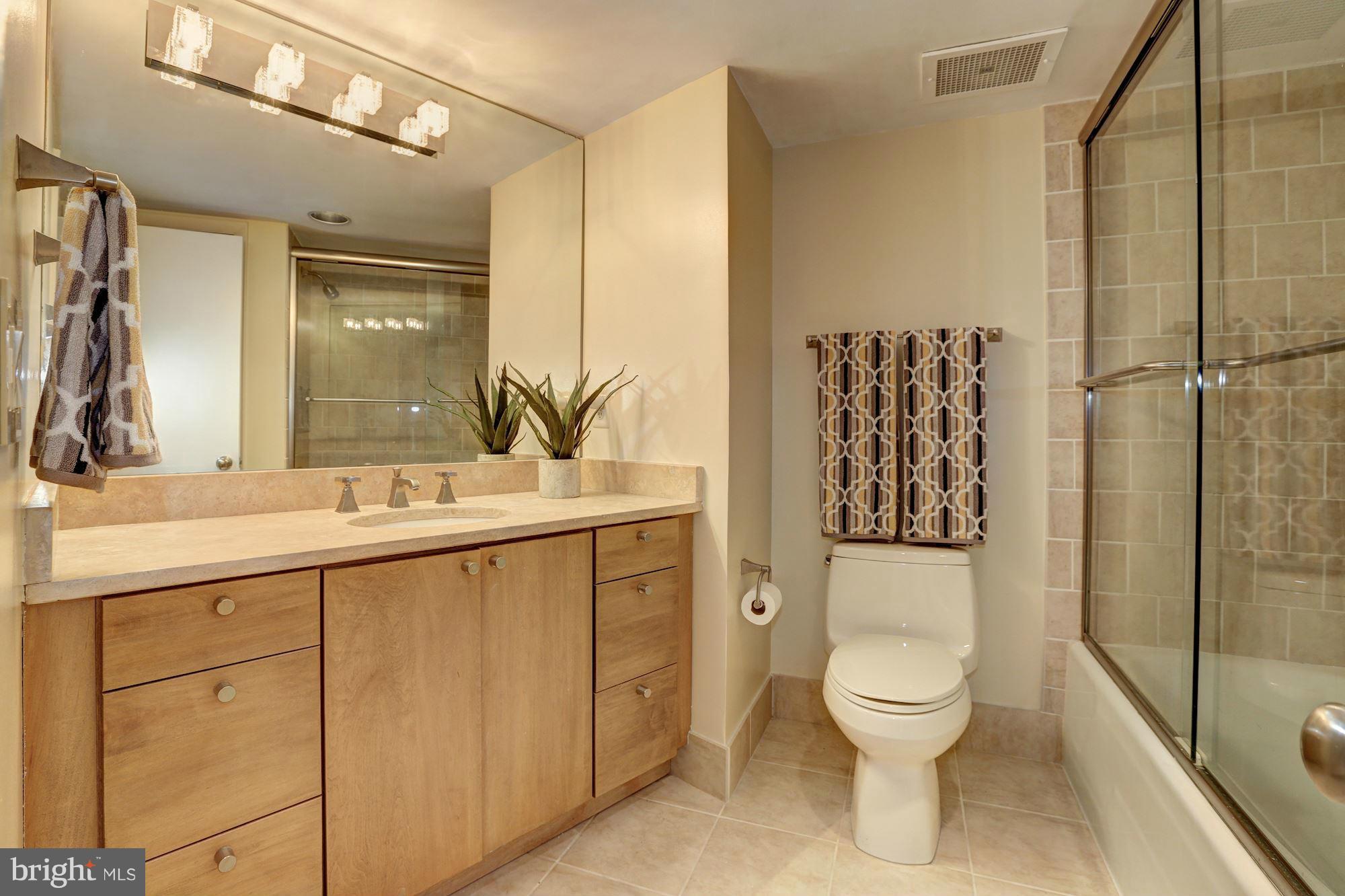 3 Washington Circle Northwest, Unit 103 Washington, DC 20037 - Photo 19 of 28 a bathroom with a toilet sink and shower
