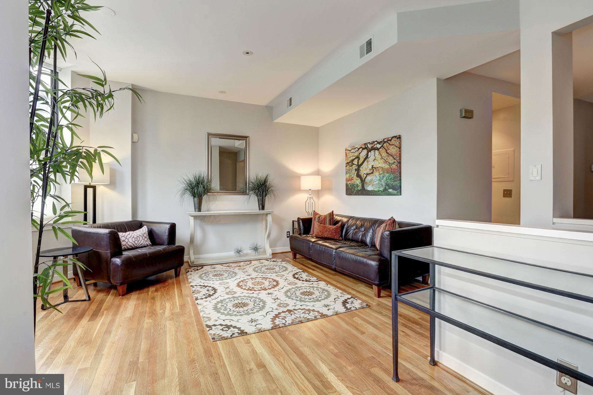 3 Washington Circle Northwest, Unit 103 Washington, DC 20037 - Photo 3 of 28 a living room with furniture and a couch