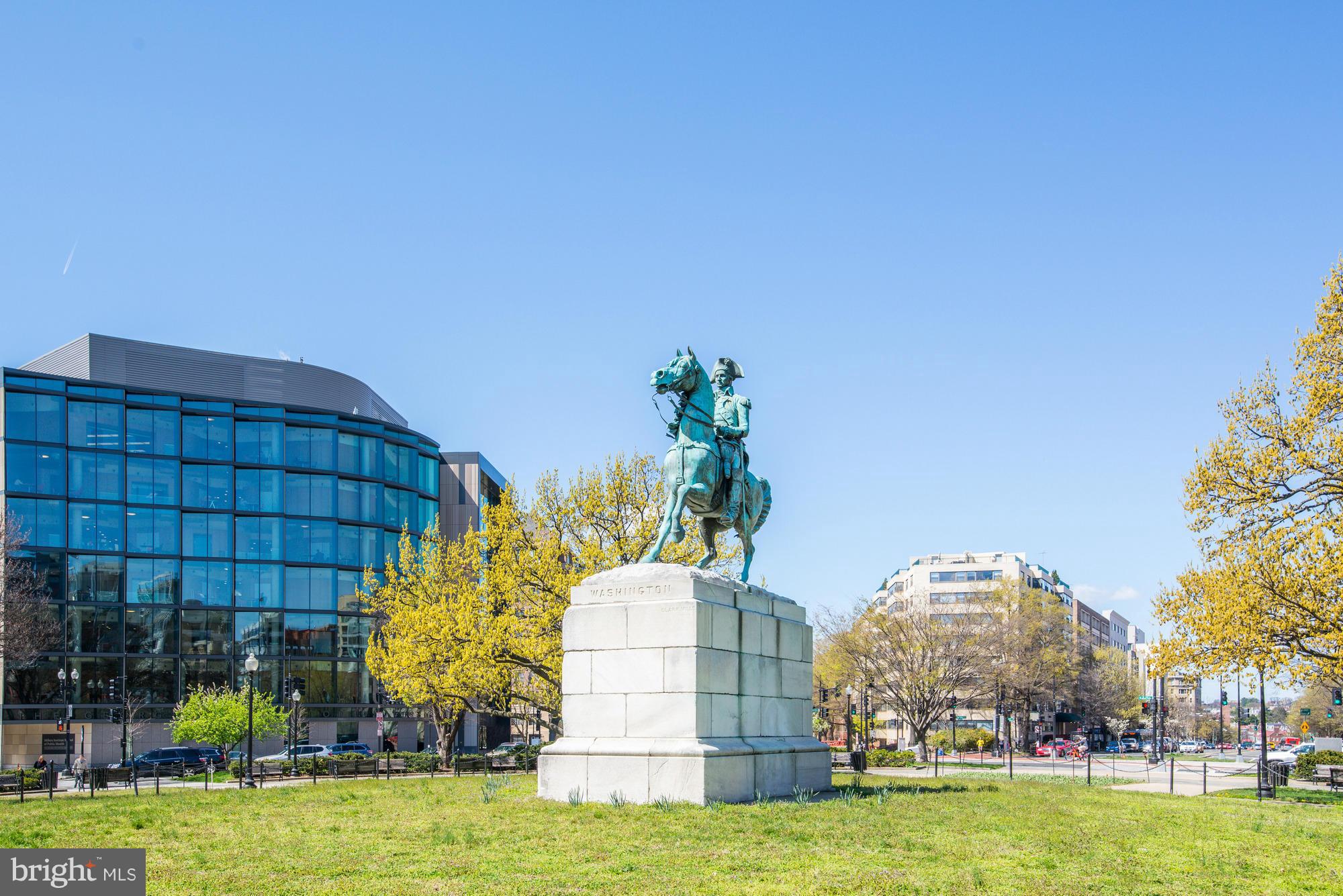 3 Washington Circle Northwest, Unit 103 Washington, DC 20037 - Photo 24 of 28 a view of a building with a big yard and large trees